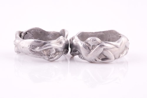 Lot 104 - A novelty pair of aluminium erotic rings,...
