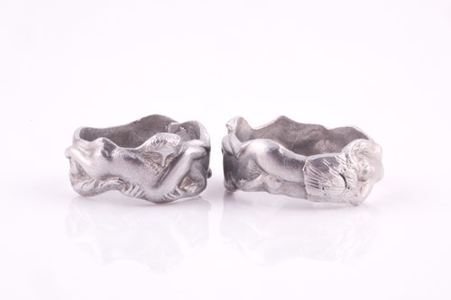 Lot 104 - A novelty pair of aluminium erotic rings,...