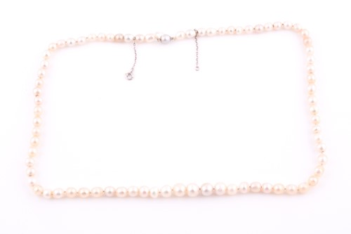Lot 261 - A strand of natural saltwater pearls, set with...