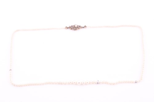 Lot 255 - A single strand natural pearl necklace, the...