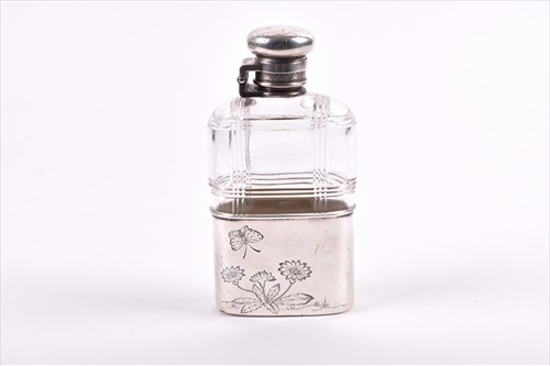 Lot 346 - Tiffany & Co. A silver mounted glass hip flask...