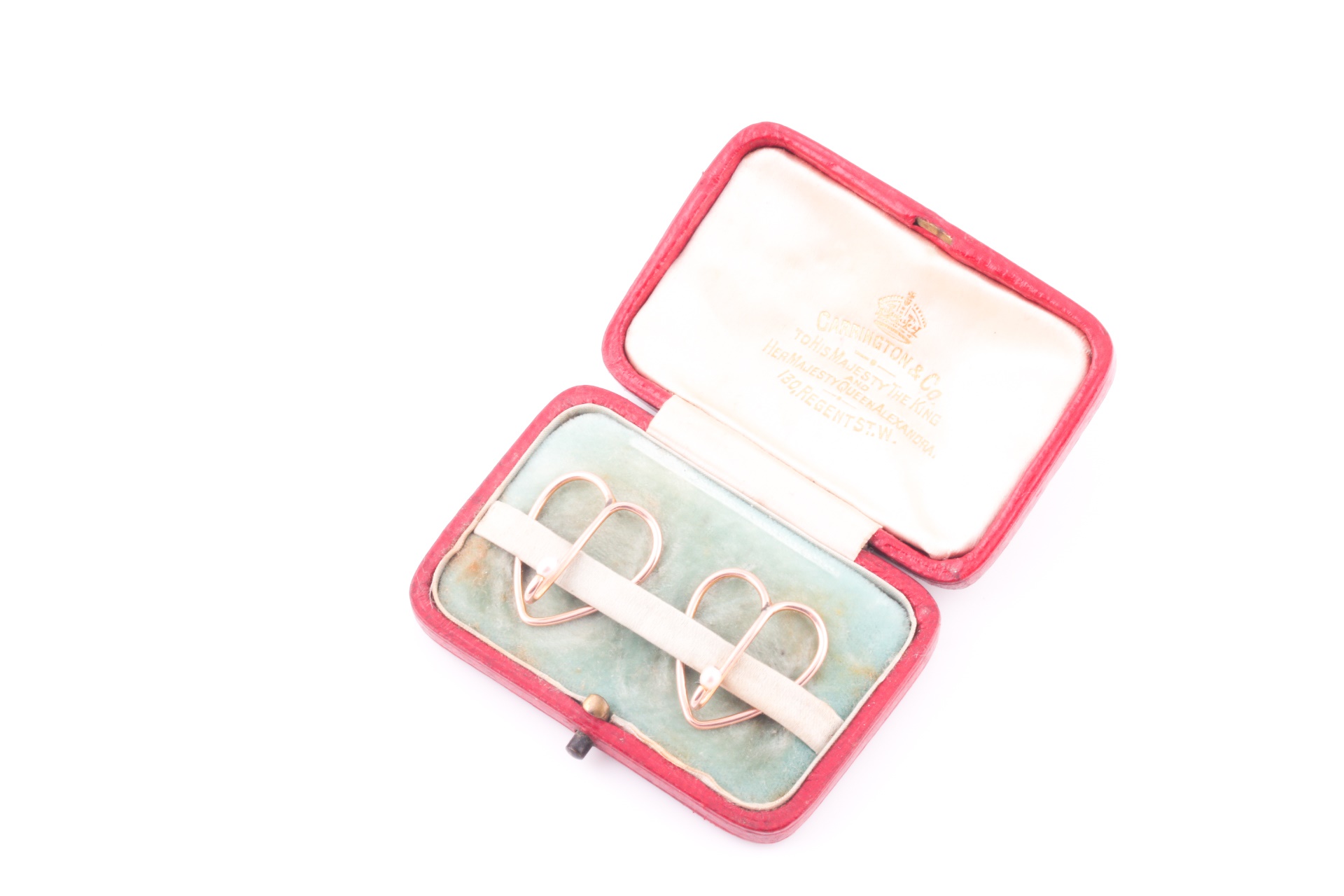 Lot 16 A pair of Edwardian garter belt hooks, in