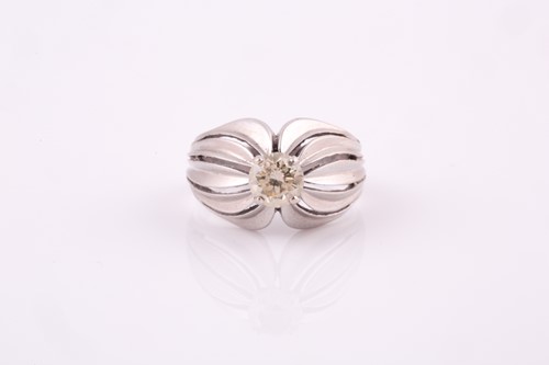 Lot 5 - A 1950's solitaire diamond ring, set in white...
