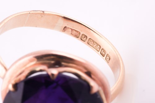Lot 9 - A 1960's amethyst solitaire ring, the round...