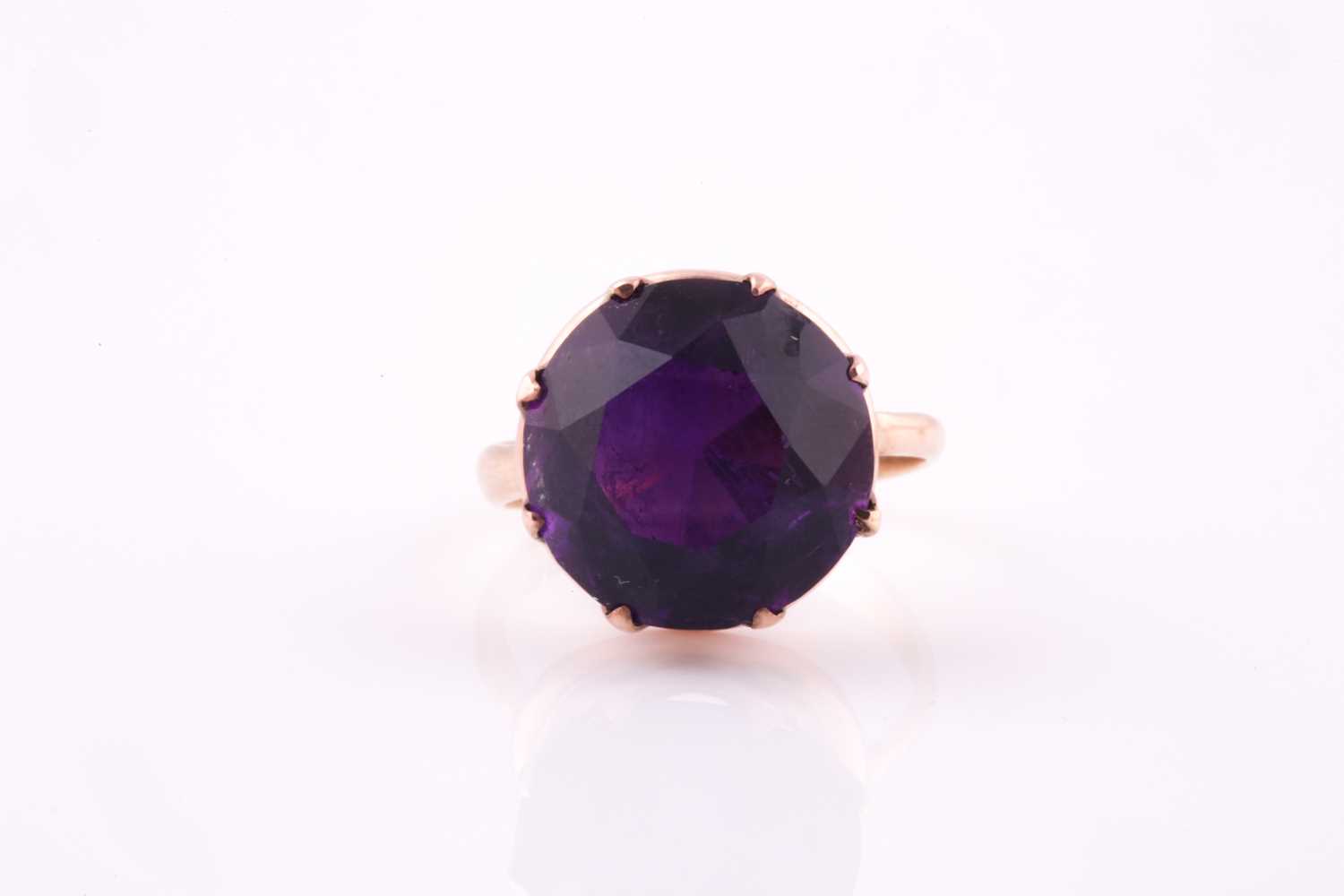 Lot 9 - A 1960's amethyst solitaire ring, the round...