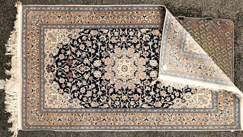 Lot 180 - A pair of Royal blue ground Kashan rug with...