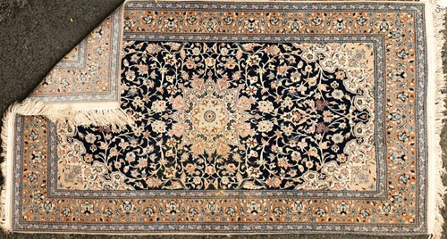 Lot 180 - A pair of Royal blue ground Kashan rug with...
