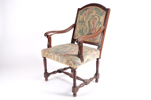 Lot 210 - A French Regency style walnut open armchair,...