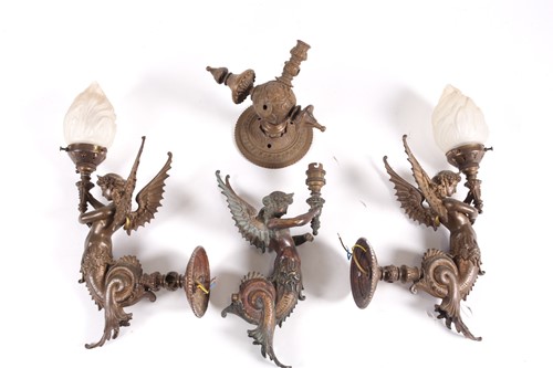 Lot 231 - A set of three bronze wall sconces, formed as...
