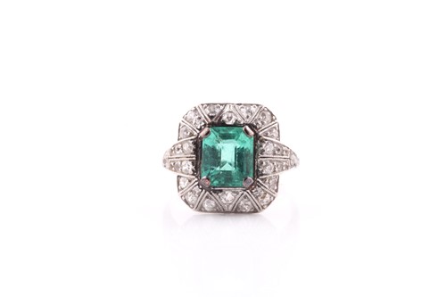 Lot 13A - An emerald and diamond dress ring, set with an...