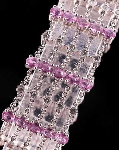 Lot 184 - An 18ct white gold, diamond, and pink sapphire...