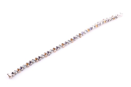 Lot 344 - A white metal and multi-gem set bracelet, set...