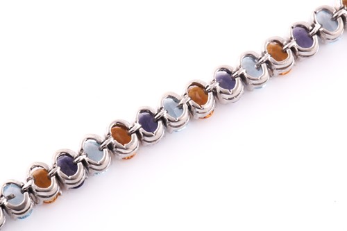 Lot 344 - A white metal and multi-gem set bracelet, set...