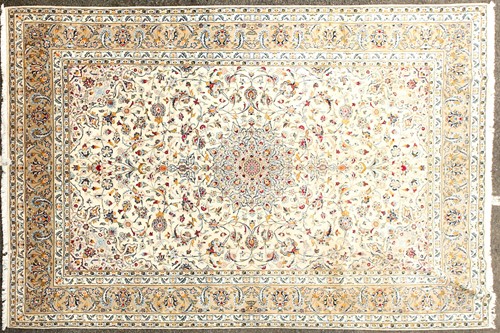 Lot 177 - An ivory ground Kashan carpet of classical...