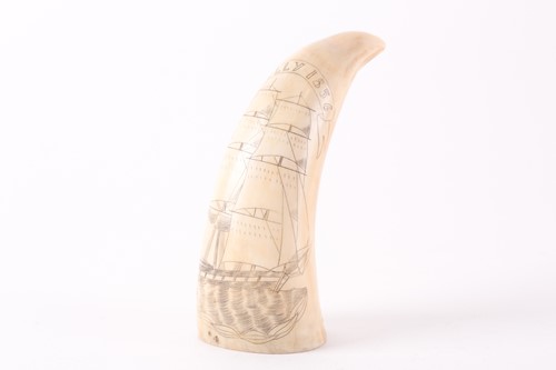 Lot 331 - A sperm whale tooth with scrimshaw decoration...