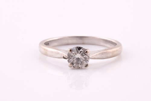 Lot 416 - A single stone diamond ring; the round...