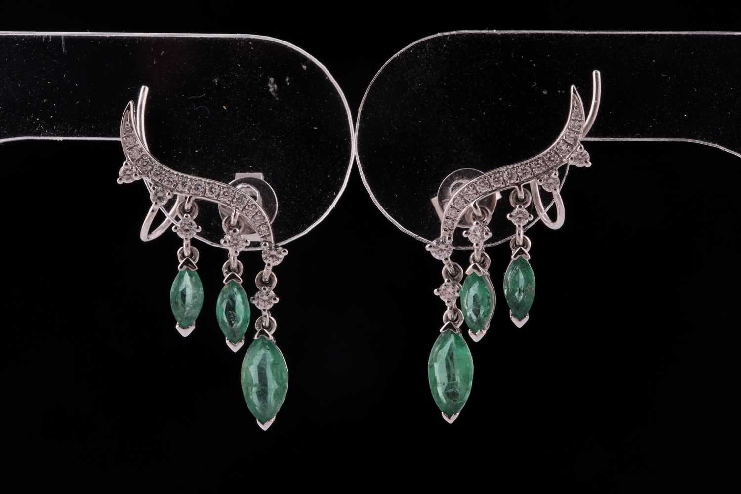Lot 192 - A pair of emerald and diamond earrings; in the...
