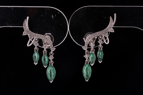 Lot 192 - A pair of emerald and diamond earrings; in the...