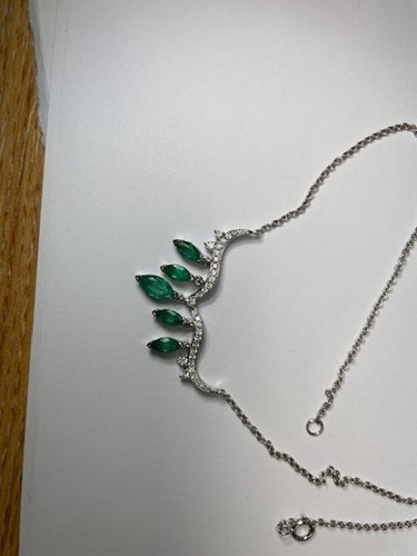 Lot 23 - An emerald and diamond necklace; the...