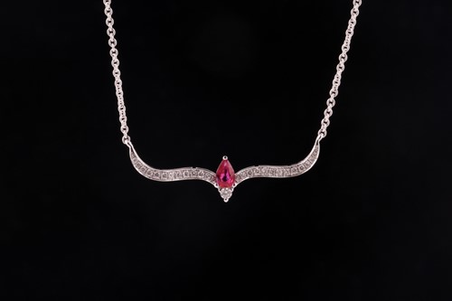 Lot 178 - A ruby and diamond necklace; the fixed scroll...