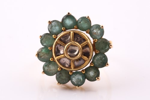 Lot 460 - An emerald and diamond cluster ring; composed...