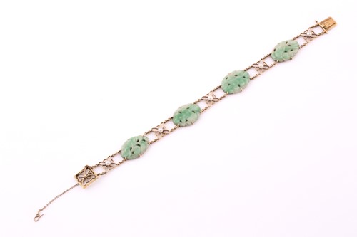 Lot 13 - A jade and seed pearl bracelet; comprising...