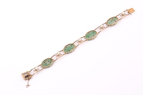 Lot 13 - A jade and seed pearl bracelet; comprising...