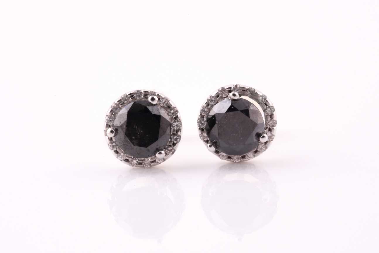 Lot 204 - A pair of black diamond and diamond cluster...