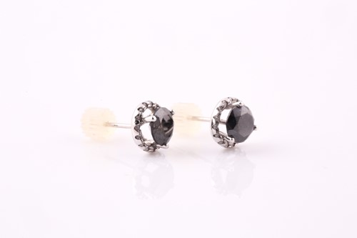 Lot 204 - A pair of black diamond and diamond cluster...