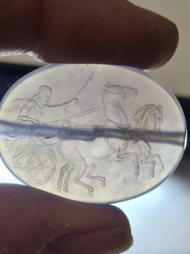 Lot 498 - A Roman-style carved amethyst glass oval...