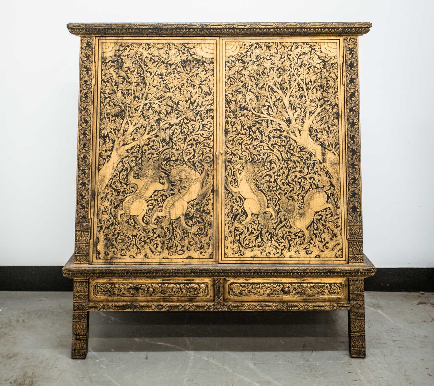 Lot 109 - A Tibetan inverted tapering lacquered cabinet,...