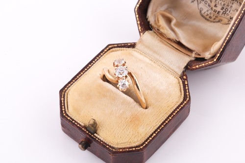 Lot 130 - An 18ct yellow gold and diamond crossover ring,...