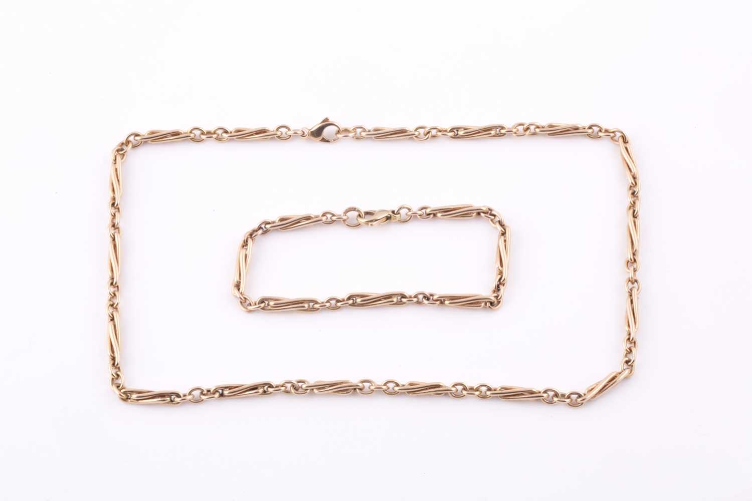 Lot 212 - A 9ct yellow gold facny twist-link necklace,...