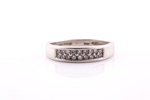 Lot 404 - A platinum and diamond ring, the shank...