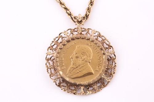 Lot 21 - A Krugerrand pendant and ropetwist chain; the...