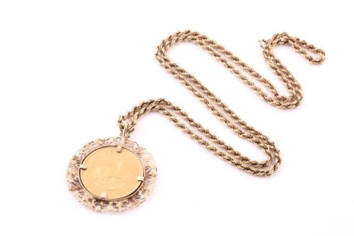 Lot 21 - A Krugerrand pendant and ropetwist chain; the...