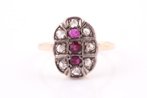 Lot 286 - An 18ct yellow gold, diamond, and ruby ring,...