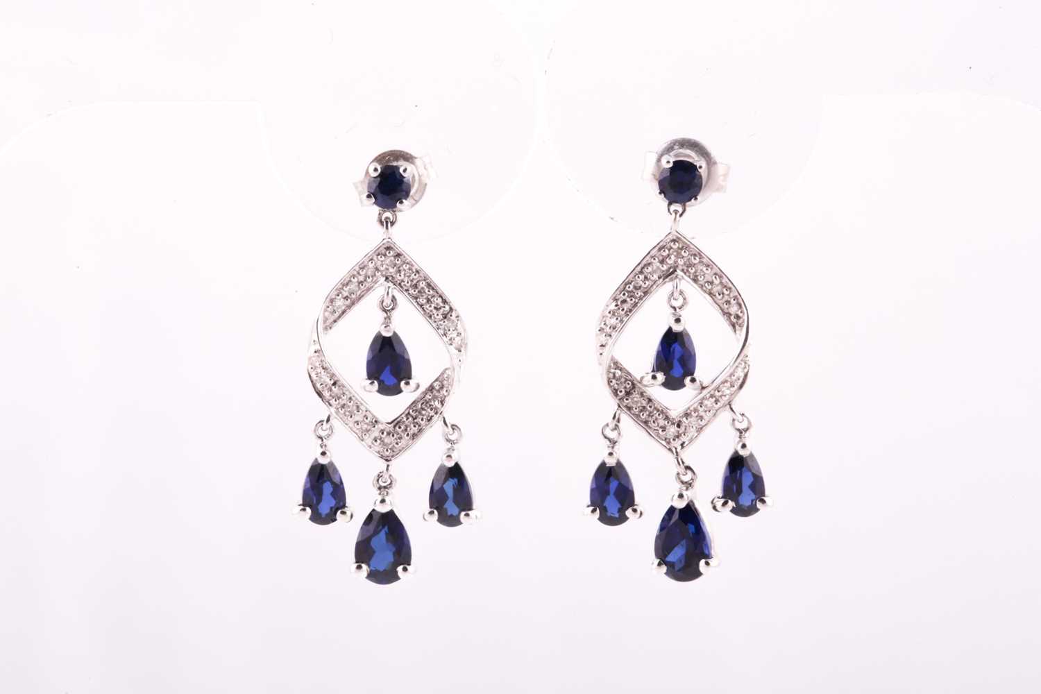 Lot 117 - A pair of 9ct white gold diamond, and sapphire...
