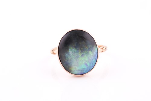 Lot 81 - A yellow metal and boulder opal ring, the...