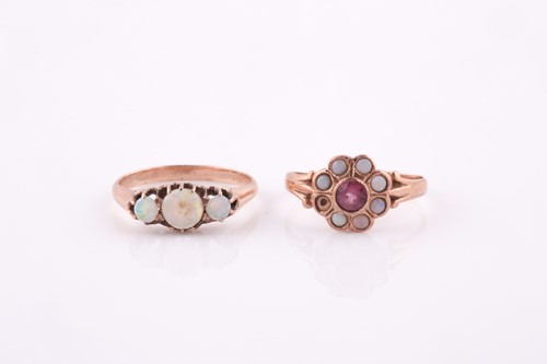 Lot 419 - A rose gold and opal ring, set with three...