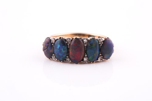 Lot 456 - An 18ct yellow gold and opal ring, set with...