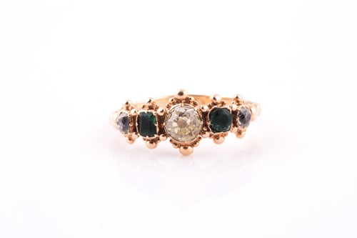 Lot 296 - A yellow metal, diamond, and emerald ring, set...