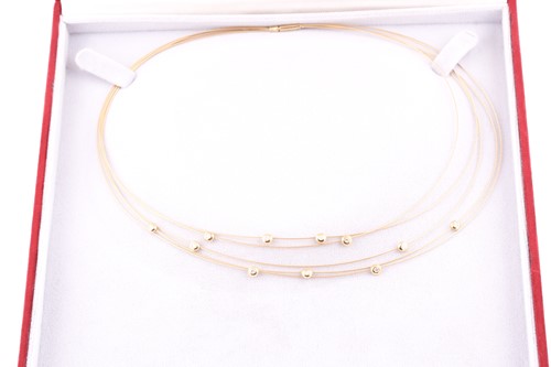 Lot 189 - A yellow metal collar necklace the five...