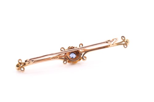 Lot 104 - A 15ct yellow gold, sapphire, and pearl bar...