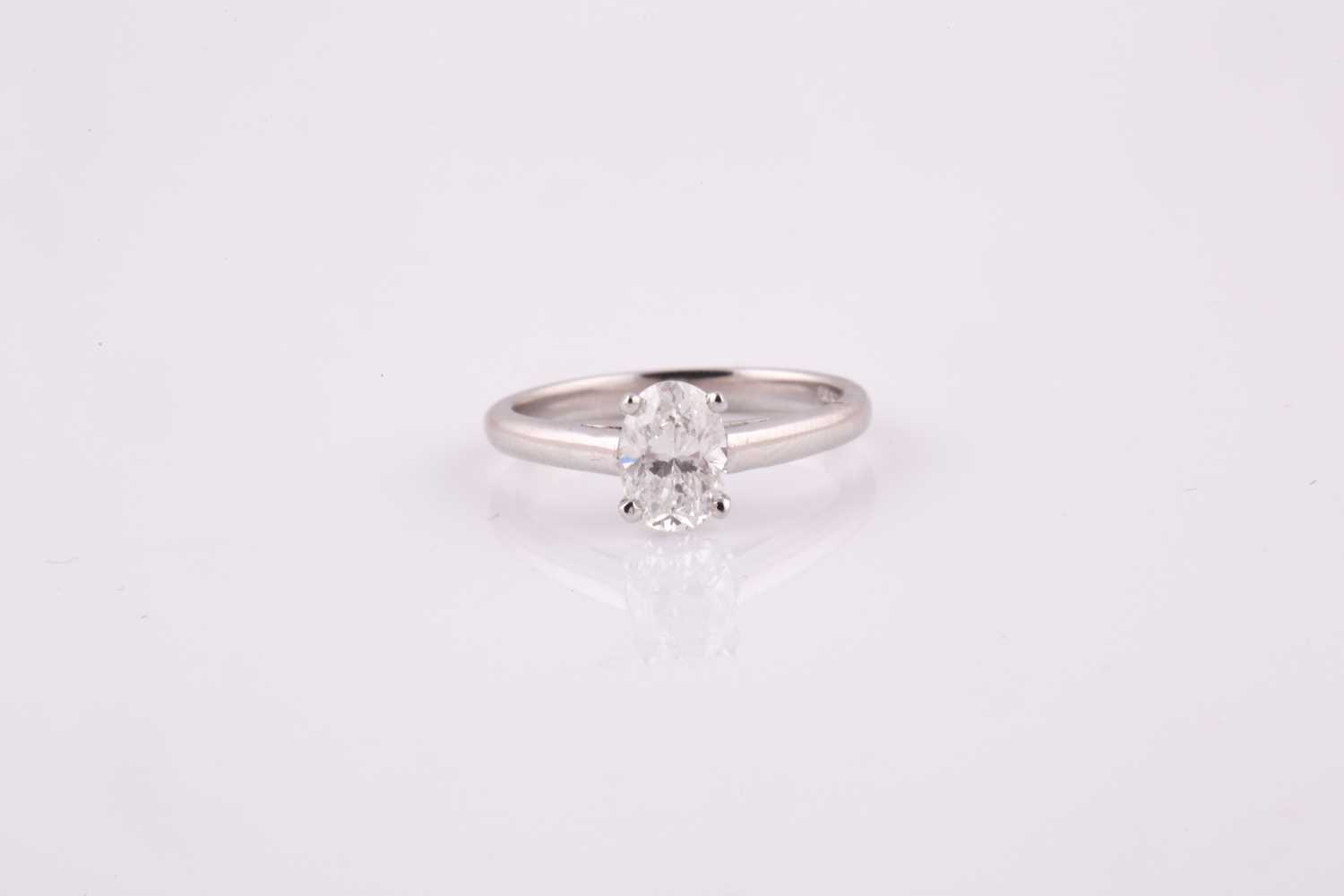 Lot 406 - An oval brilliant cut solitaire diamond ring...