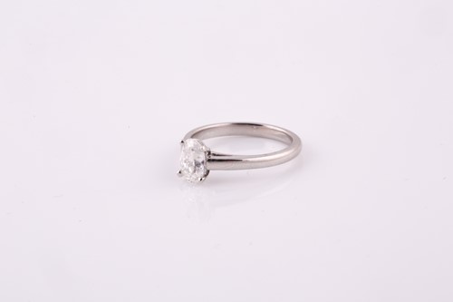 Lot 406 - An oval brilliant cut solitaire diamond ring...