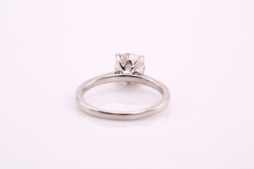 Lot 244 - A platinum and diamond ring, the solitaire...
