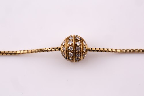 Lot 30 - A diamond pavé set spherical pendant necklace,...