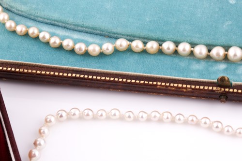 Lot 145 - A cultured pearl necklace, set with graduated...