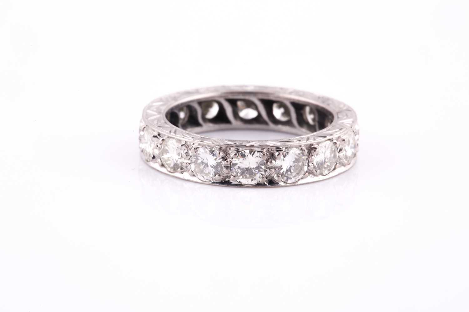 Lot 418 - A diamond and platinum full eternity ring, set...